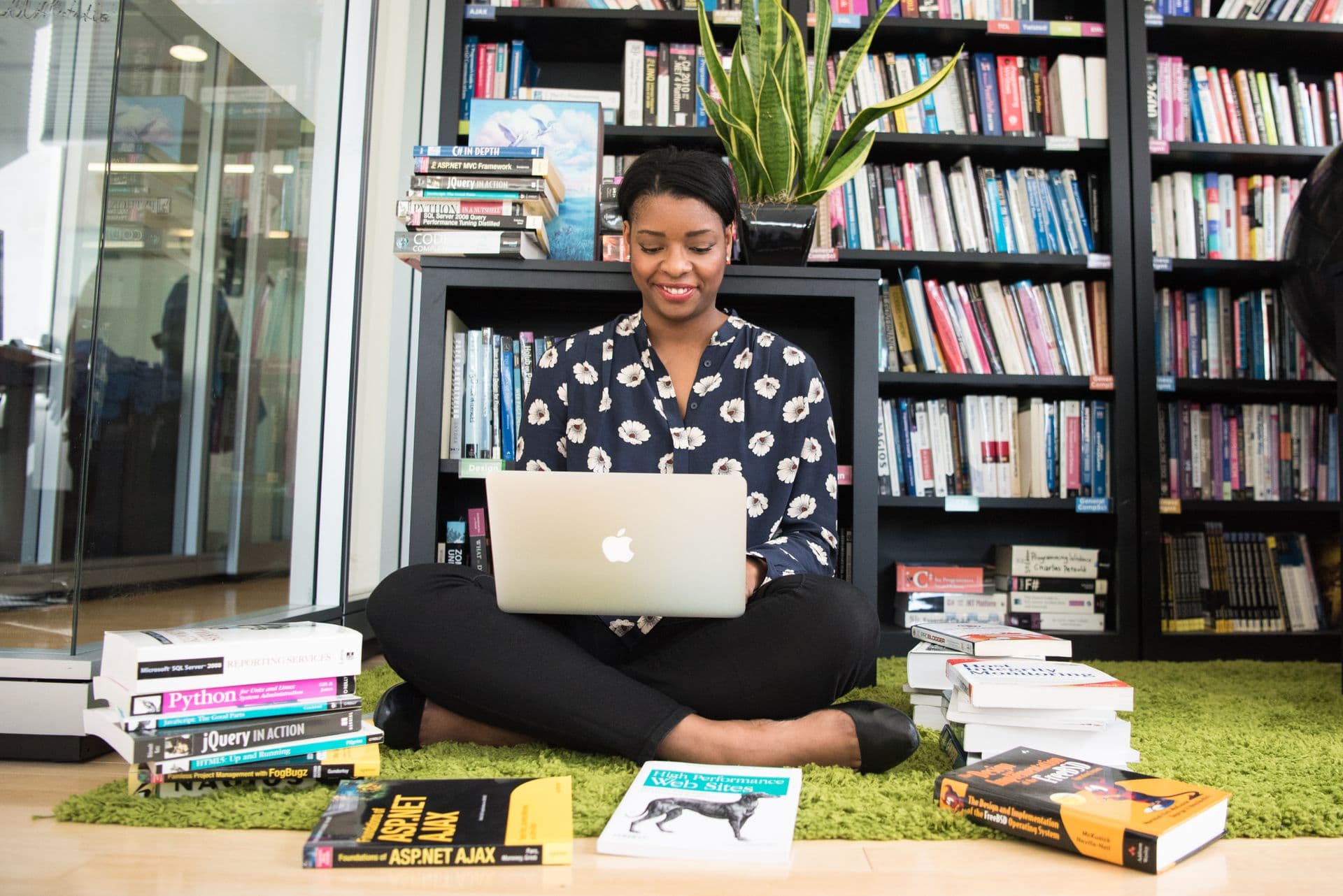 Young African developer or student working on a laptop